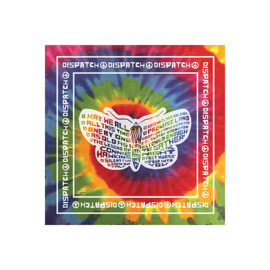 A tie-dye bandana with a multicolored pattern and text that reads 'DISPATCH' and 'HELIOSIS'. The bandana is 22 inches by 22 inches.